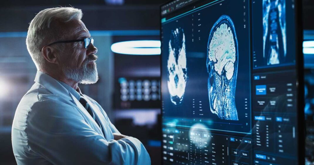 kramtomoji guma ir smegenys – mokslininkas analizuoja smegenų aktyvumo vaizdus ekrane