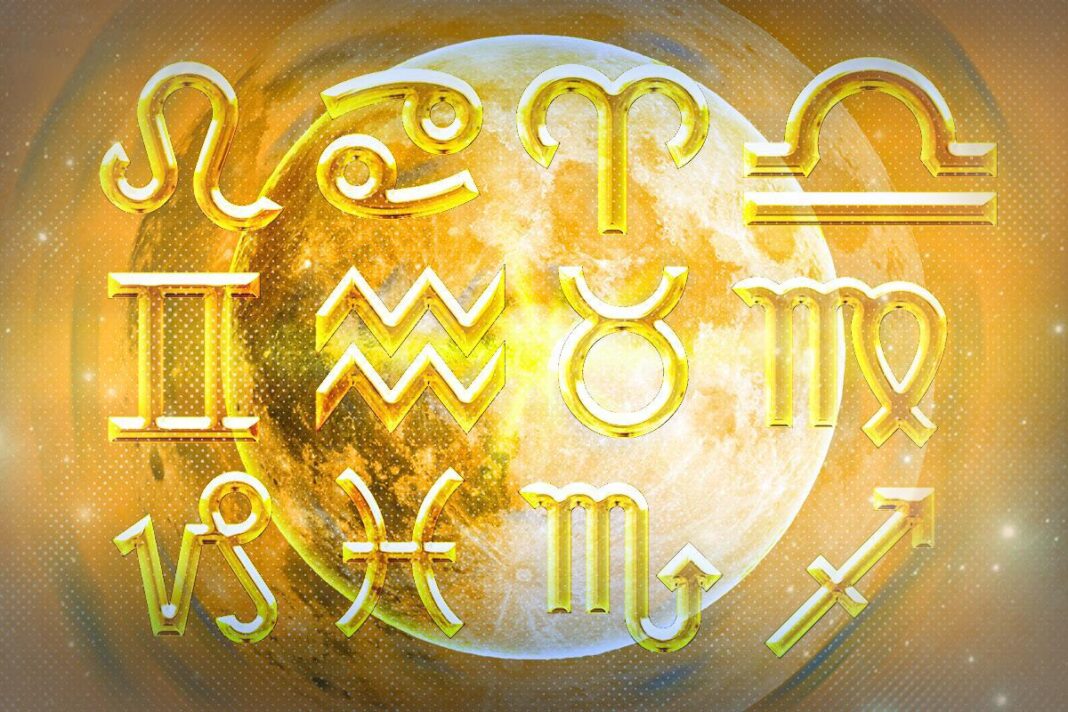 Auksiniai dvylikos Zodiako ženklų simboliai priešais švytintį Mėnulį