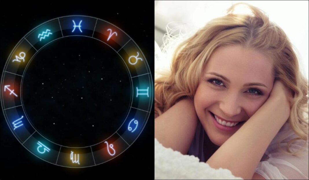 Šviečiantis zodiako ženklų ratas šalia besišypsančios blondinės portreto